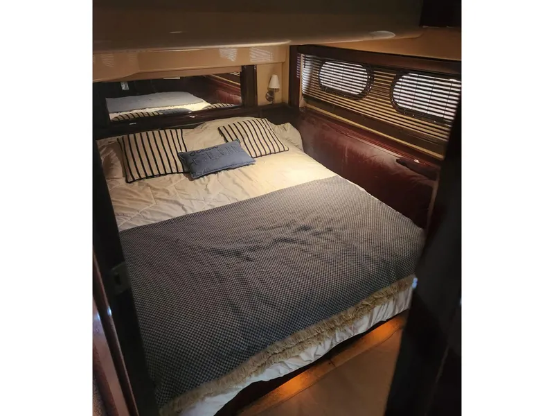 Slide: The Image of Luxurious bedroom interior of 2007 Sea Ray 52 Sedan Bridge yacht. - 12