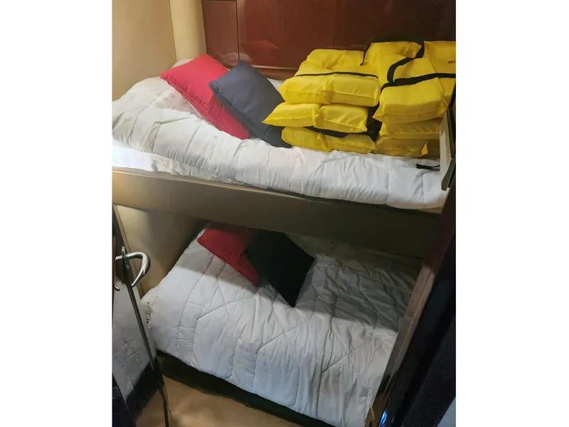 Slide: The Image of Bunk beds with life jackets in 2007 Sea Ray 52 Sedan Bridge cabin. - 16