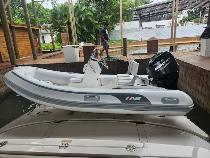 Slide: The Image of 2007 Sea Ray 52 Sedan Bridge with AB inflatable boat and Mercury outboard motor. - 17