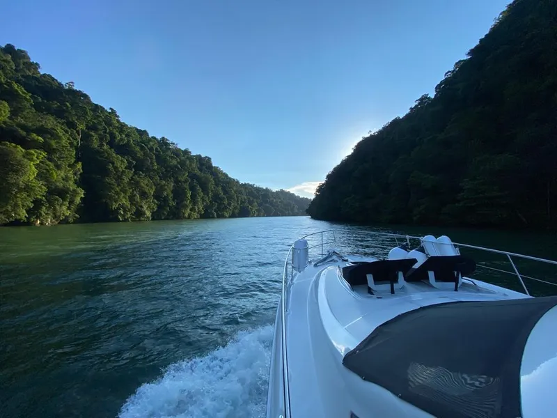 Slide: The Image of 2007 Sea Ray 52 Sedan Bridge cruising through scenic river canyon. - 18