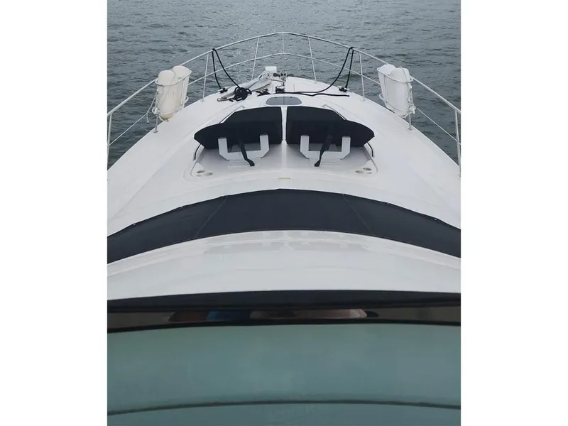Slide: The Image of 2007 Sea Ray 52 Sedan Bridge yacht deck view on water. - 4