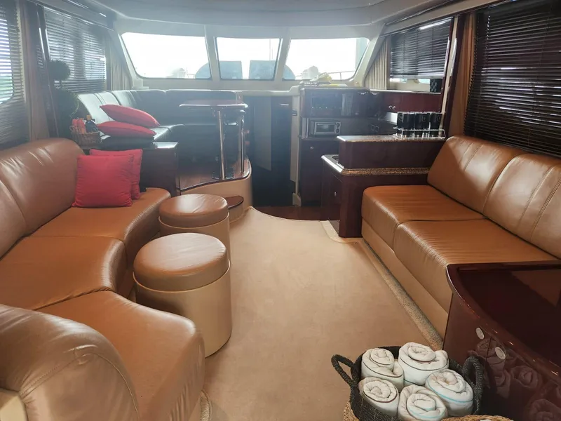 Slide: The Image of Luxurious interior of 2007 Sea Ray 52 Sedan Bridge yacht with leather seating and modern amenities. - 8