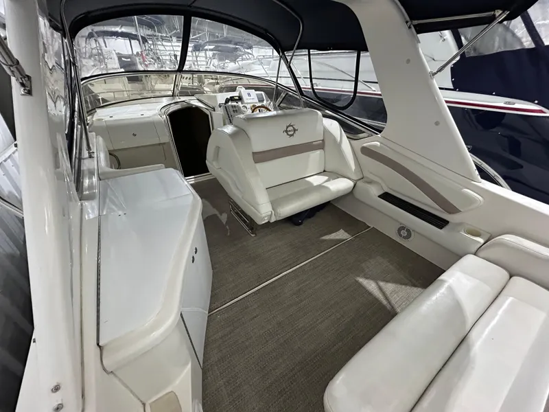 Slide: The Image of 2002 Fountain 38 Express Cruiser interior with white seating and spacious layout. - 12