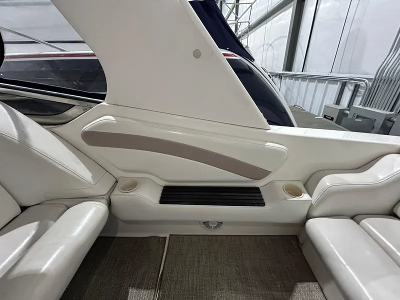 Slide: The Image of Interior seating of 2002 Fountain 38 Express Cruiser with white upholstery. - 14