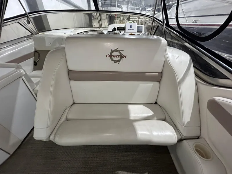 Slide: The Image of Interior of 2002 Fountain 38 Express Cruiser with white leather seating. - 17