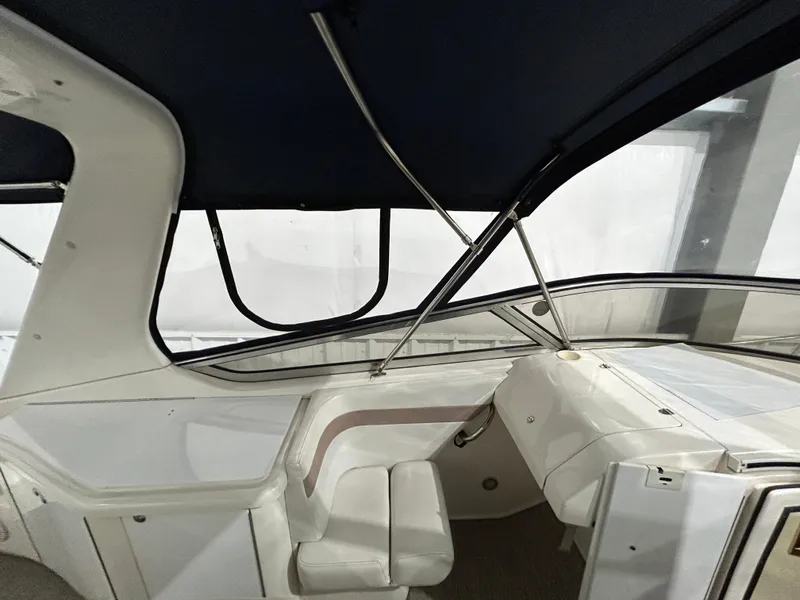 Slide: The Image of 2002 Fountain 38 Express Cruiser interior with seating and helm. - 20