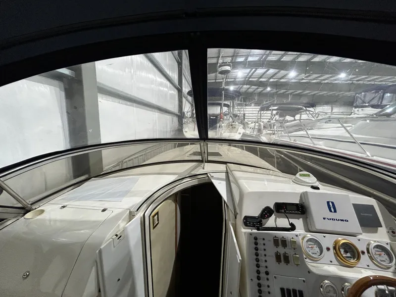 Slide: The Image of Interior view of 2002 Fountain 38 Express Cruiser in storage facility. - 24