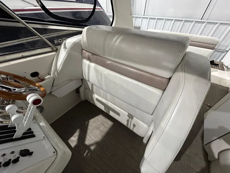 Slide: The Image of 2002 Fountain 38 Express Cruiser interior with white seating and control panel. - 26