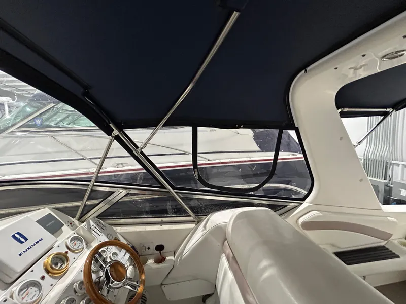 Slide: The Image of Interior view of 2002 Fountain 38 Express Cruiser with steering wheel and dashboard. - 27