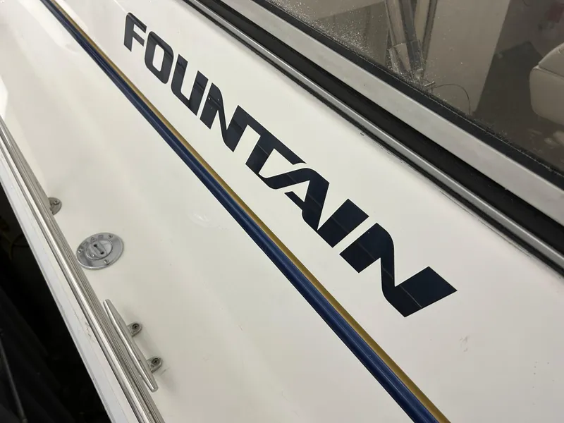 Slide: The Image of 2002 Fountain 38 Express Cruiser boat with logo detail. - 6