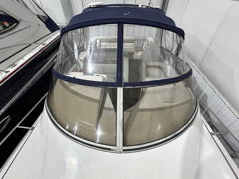 Slide: The Image of 2002 Fountain 38 Express Cruiser with clear canopy in storage. - 7