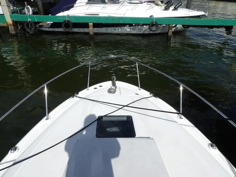 Slide: The Image of Bow view of 2004 Sea Ray 320 Sundancer docked in marina. - 4