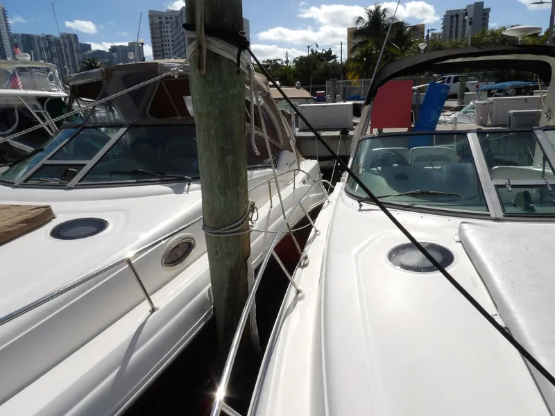 Slide: The Image of Two Sea Ray 320 Sundancer boats docked side by side, 2004 model. - 6
