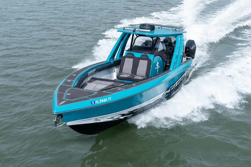 Slide: The Image of 2024 Statement 38 Open boat cruising on water, showcasing sleek design and vibrant blue color. - 13