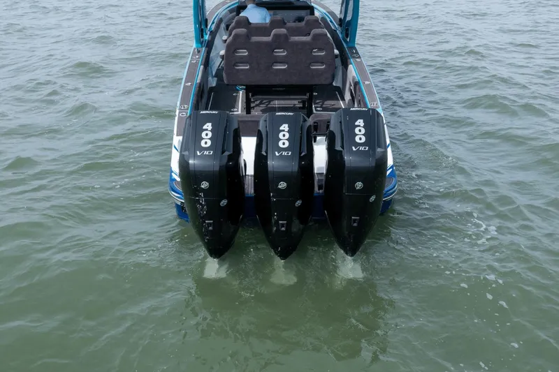 Slide: The Image of 2024 Statement 38 Open boat with triple Mercury 400 V10 engines on water. - 20