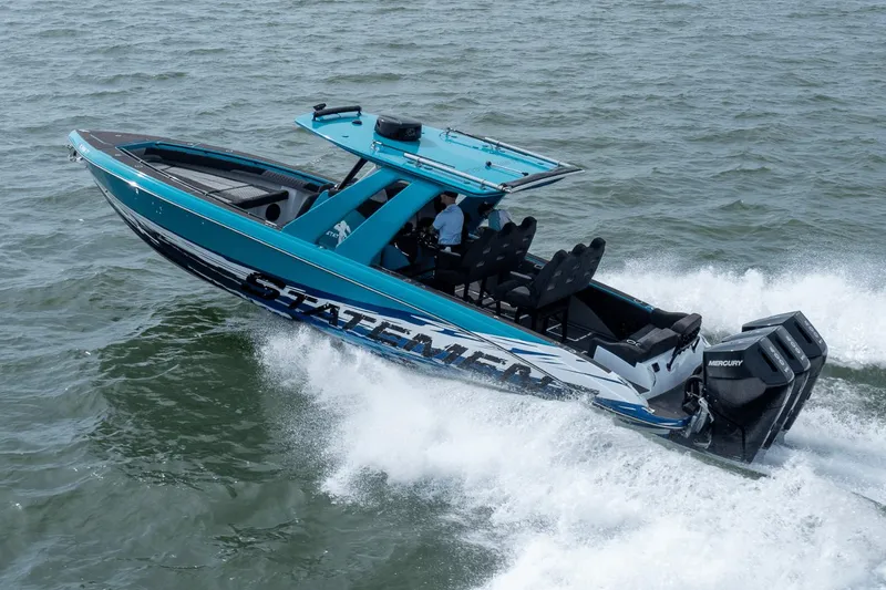 Slide: The Image of 2024 Statement 38 Open boat cruising on water with powerful Mercury engines. - 21