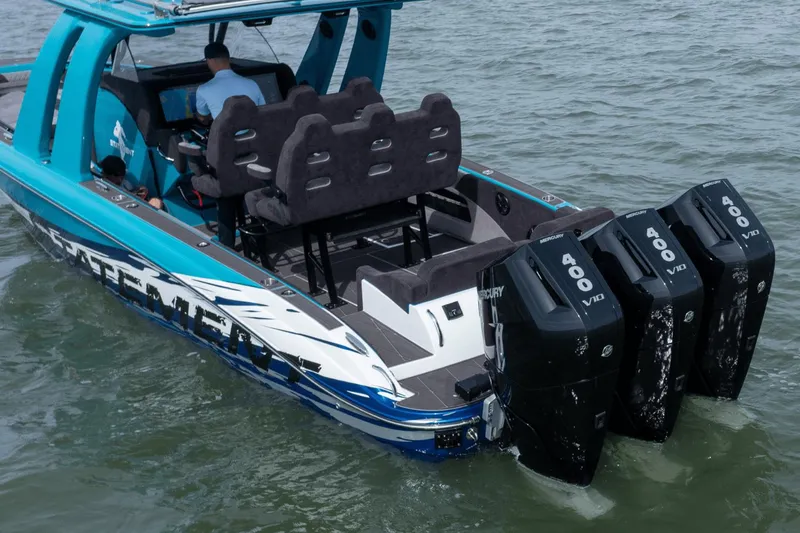 Slide: The Image of 2024 Statement 38 Open boat with four Mercury 400 V10 engines on water. - 22