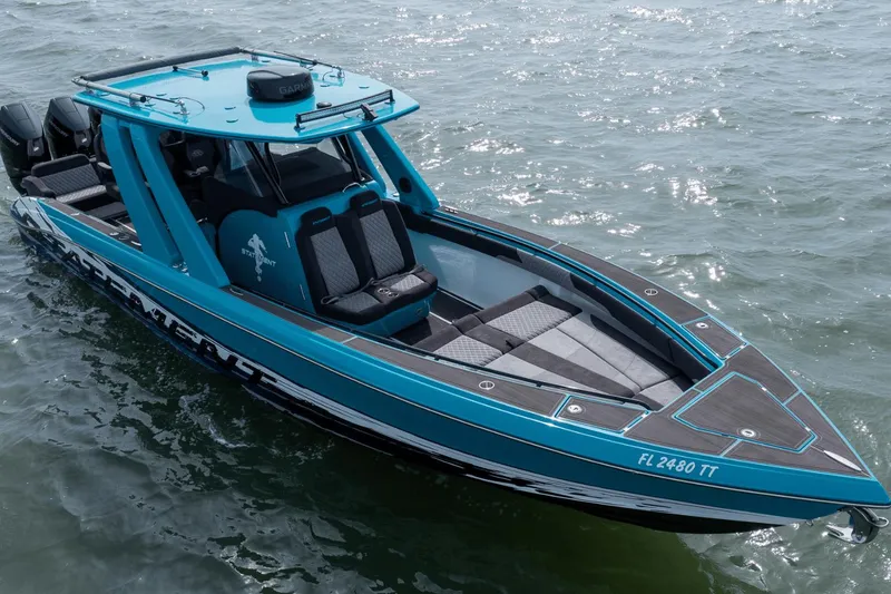 Slide: The Image of 2024 Statement 38 Open boat on water, featuring sleek design and vibrant blue color. - 23