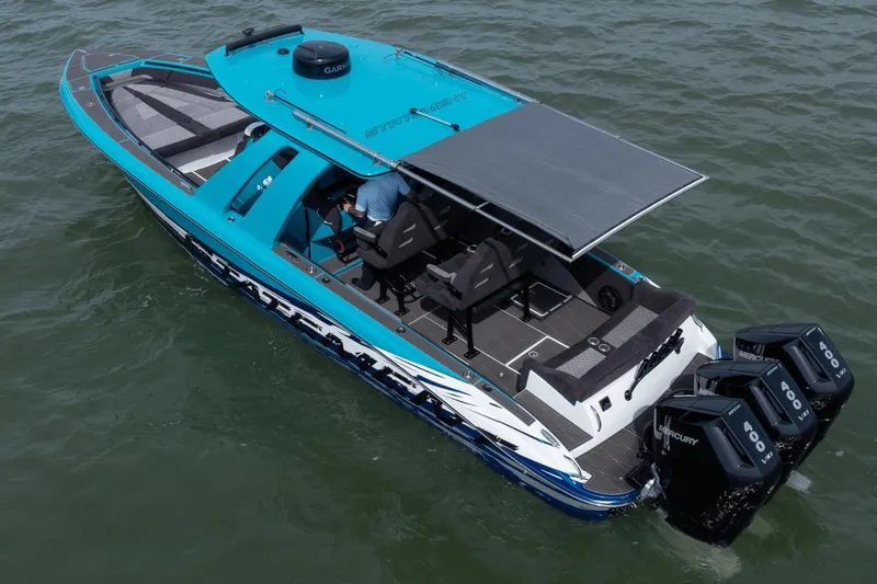 Slide: The Image of 2024 Statement 38 Open boat with triple Mercury 400 engines on the water. - 29