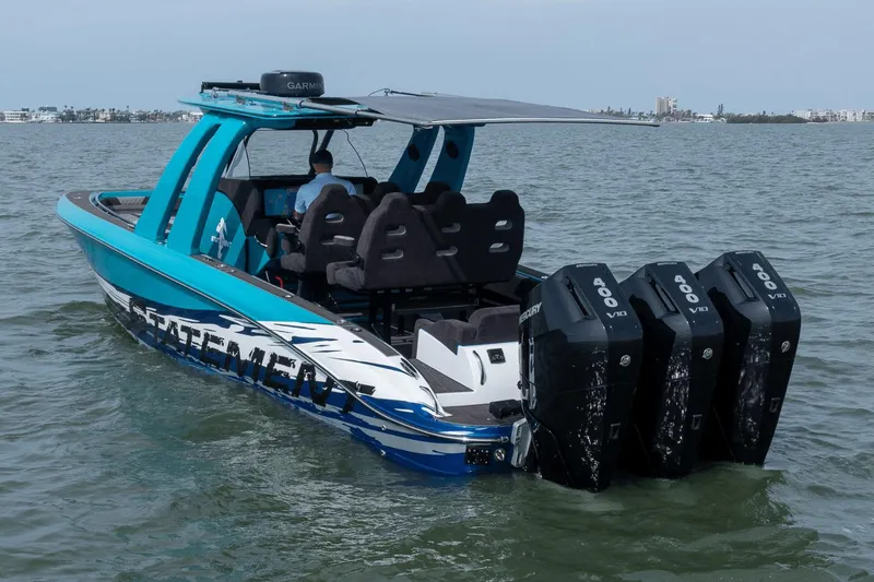 Slide: The Image of 2024 Statement 38 Open boat with four Mercury 400 V10 engines on the water. - 30