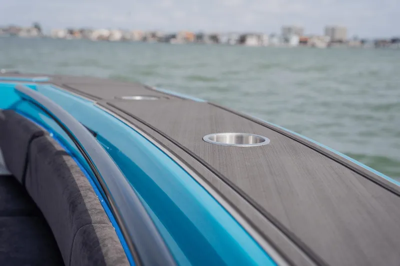 Slide: The Image of 2024 Statement 38 Open boat deck with cup holder, overlooking calm waters. - 32
