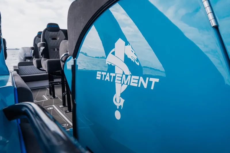 Slide: The Image of 2024 Statement 38 Open boat interior with logo, featuring sleek seating and modern design. - 33
