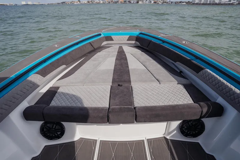 Slide: The Image of 2024 Statement 38 Open boat interior with luxurious seating and modern design on the water. - 34
