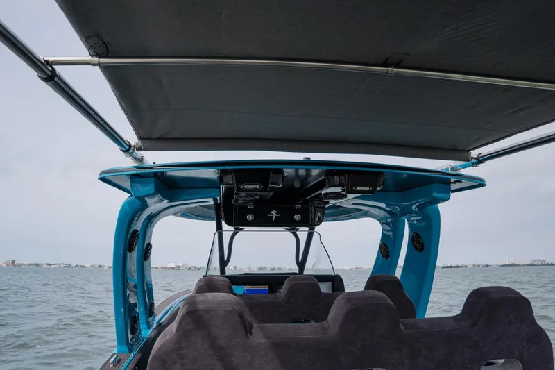 Slide: The Image of 2024 Statement 38 Open boat interior with canopy, ocean view in background. - 45