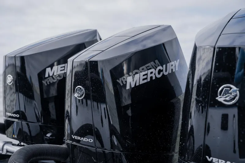 Slide: The Image of Triple Mercury Verado engines on a 2024 Statement 38 Open boat. - 48