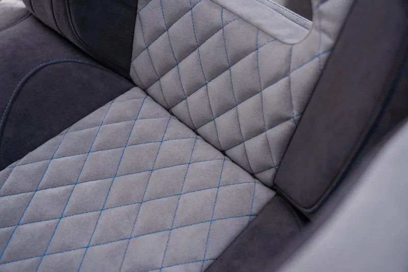 Slide: The Image of Luxurious quilted upholstery with blue stitching in 2024 Statement 38 Open model. - 49