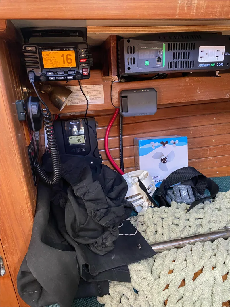 Slide: The Image of 1988 Cabo Rico 38 yacht interior with radio equipment and nautical gear. - 16