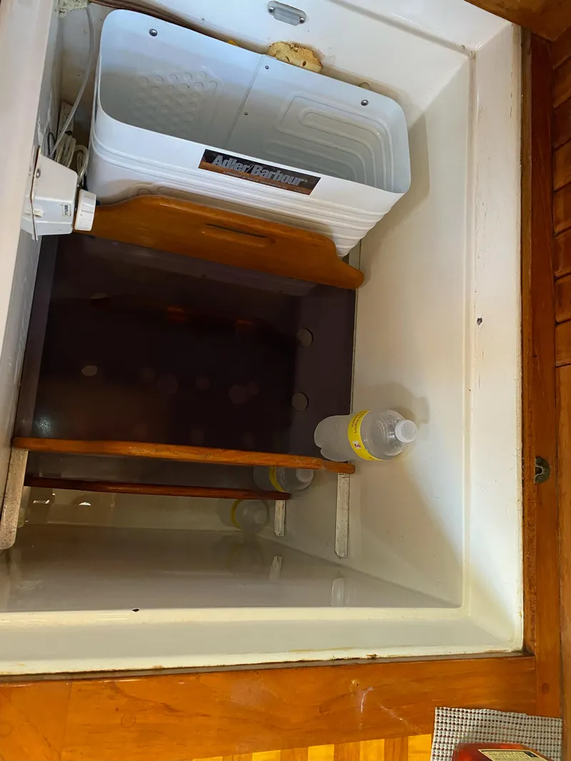 Slide: The Image of Interior storage compartment of 1988 Cabo Rico 38 sailboat with organized shelves. - 7