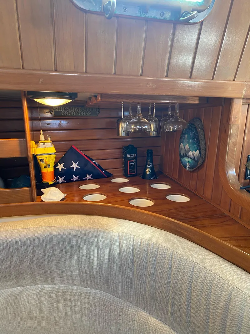 Slide: The Image of Cozy 1988 Cabo Rico 38 yacht interior with wooden shelves and nautical decor. - 8