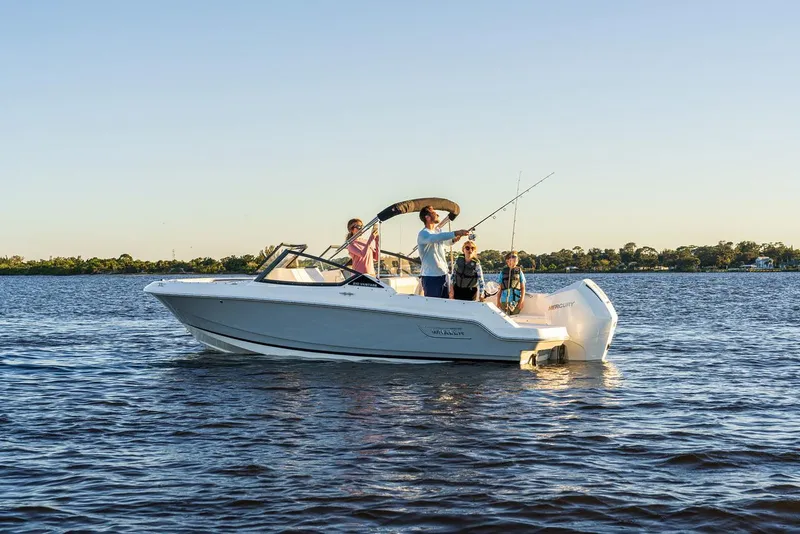 Slide: The Image of 2024 Boston Whaler 210 Vantage boat on water with people fishing. - 39