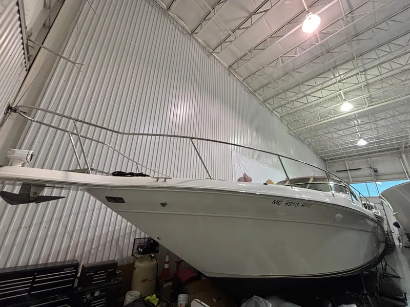 Slide: The Image of 1999 Sea Ray 450 Sundancer yacht in indoor storage facility. - 1