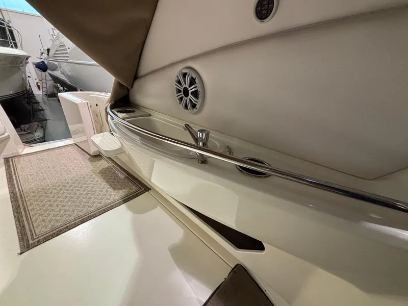 Slide: The Image of Luxurious interior of 1999 Sea Ray Sundancer 450 yacht with plush seating and elegant decor. - 12