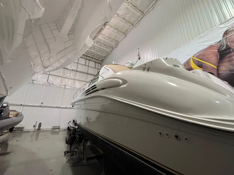 Slide: The Image of 1999 Sea Ray 450 Sundancer yacht in indoor storage facility. - 2