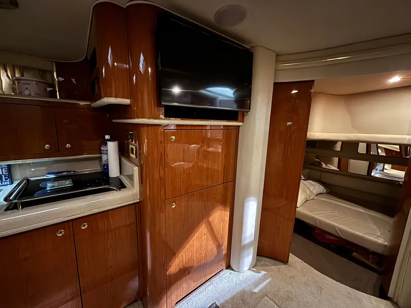Slide: The Image of Luxurious interior of 1999 Sea Ray Sundancer 450 yacht with plush seating and elegant design. - 25