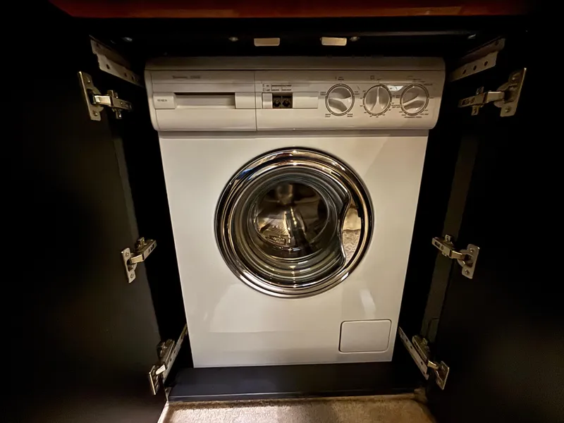 Slide: The Image of 1999 Sea Ray Sundancer 450 yacht kitchen with wood cabinets and modern appliances. - 27