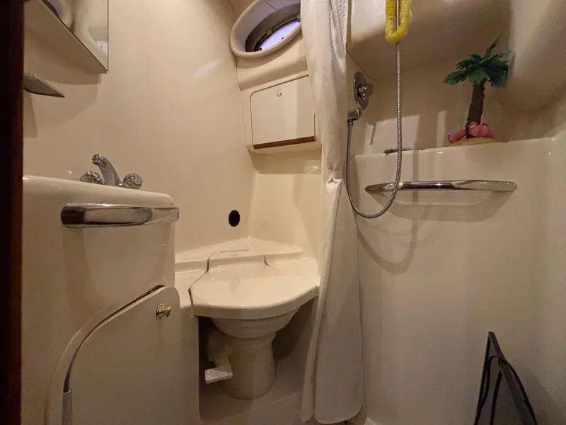 Slide: The Image of Interior of 1999 Sea Ray Sundancer 450 with wooden doors and hanging towel. - 35