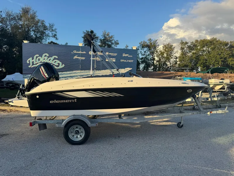 Slide: The Image of 2025 Bayliner Element E16 boat on trailer, outdoor display setting. - 2
