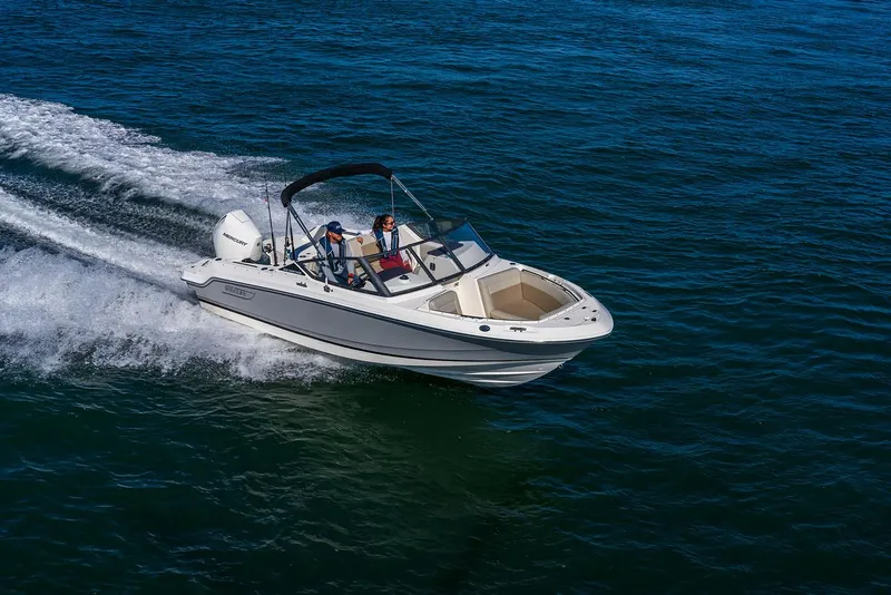 Slide: The Image of 2025 Boston Whaler 210 Vantage cruising on open water. - 15