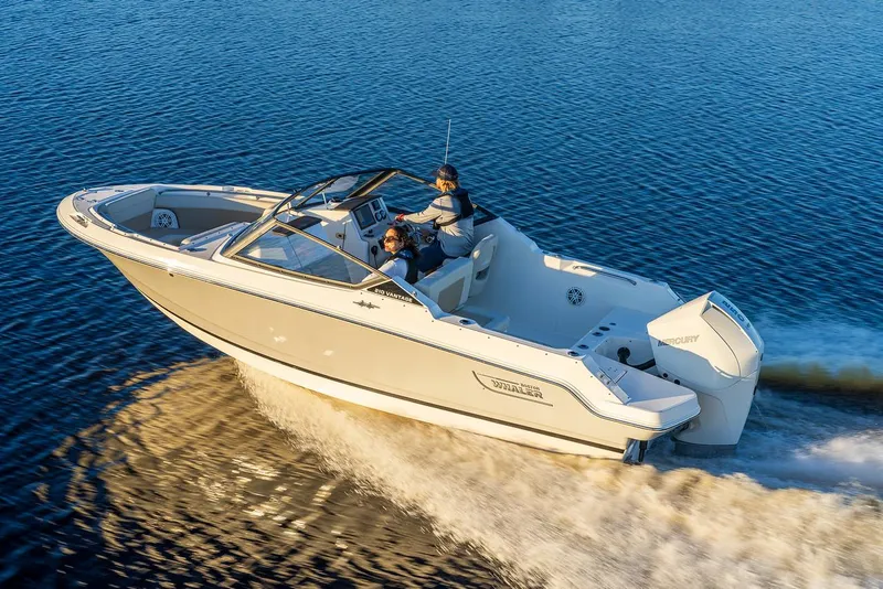 Slide: The Image of 2025 Boston Whaler 210 Vantage cruising on open water. - 5