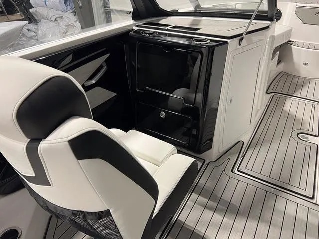 Slide: The Image of Interior of 2025 Yamaha Boats 222SD, featuring sleek seating and modern design elements. - 13