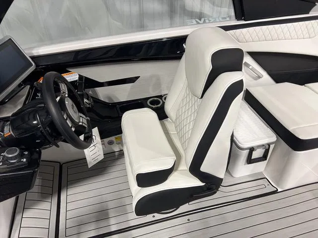 Slide: The Image of 2025 Yamaha Boats 222SD interior with sleek white seating and modern dashboard. - 16