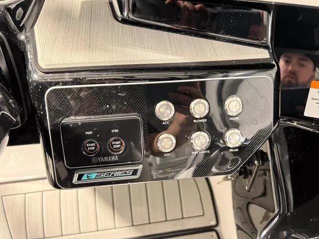 Slide: The Image of Control panel of 2025 Yamaha Boats 222SD, featuring start/stop buttons and accessory switches. - 21