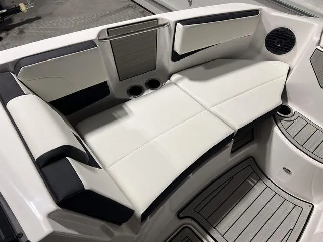 Slide: The Image of Luxurious seating area on 2025 Yamaha Boats 222SD with sleek design and cup holders. - 25