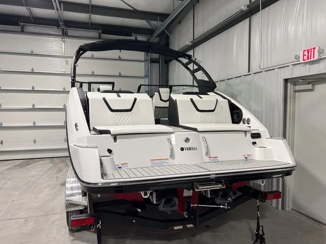 Slide: The Image of 2025 Yamaha Boats 222SD in a garage, showcasing sleek design and modern features. - 5