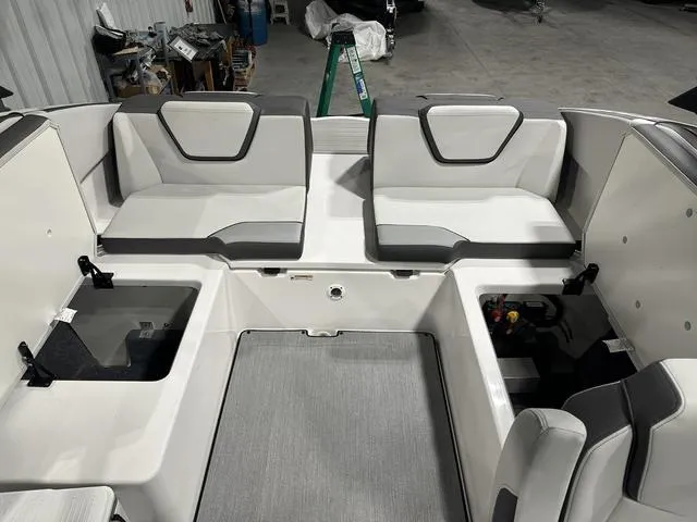 Slide: The Image of 2025 Yamaha AR250 boat interior with spacious seating and storage compartments. - 12