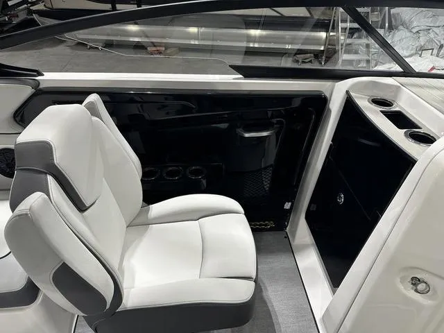 Slide: The Image of 2025 Yamaha AR250 boat interior with white seating and cup holders. - 15